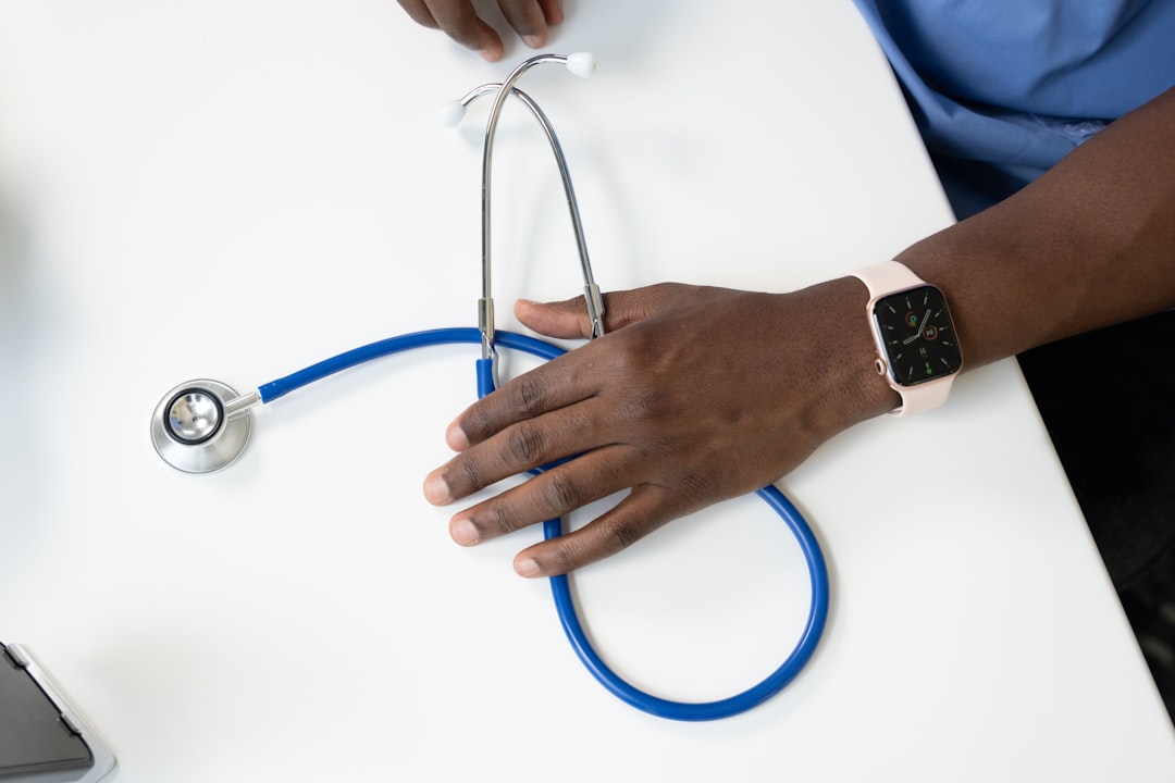 hand holding stethoscope hand holding stethoscope
