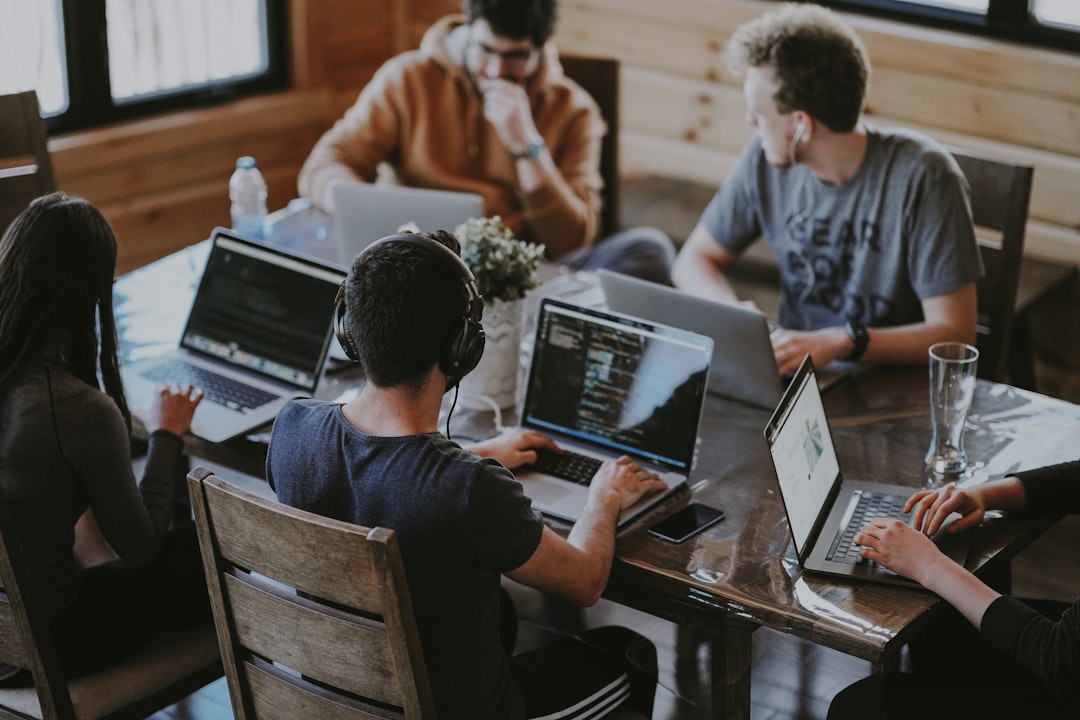 people working in group setting people working in group setting