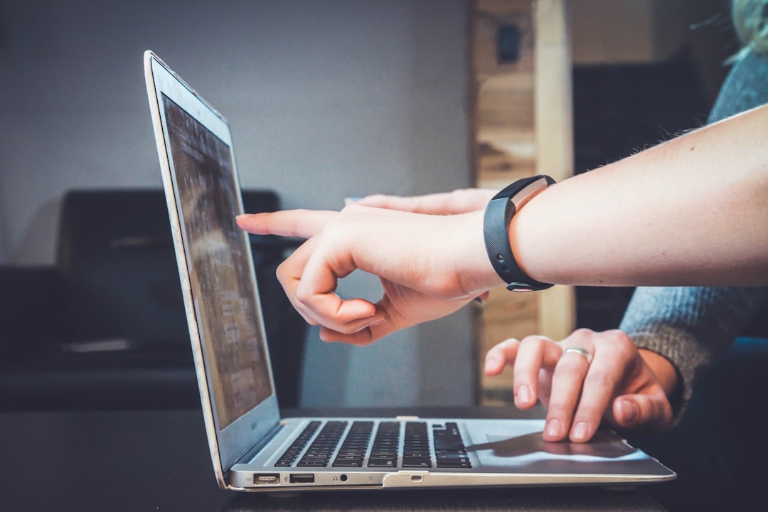 hands and a laptop hands and a laptop