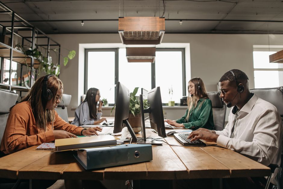 people working in an open workspace setting