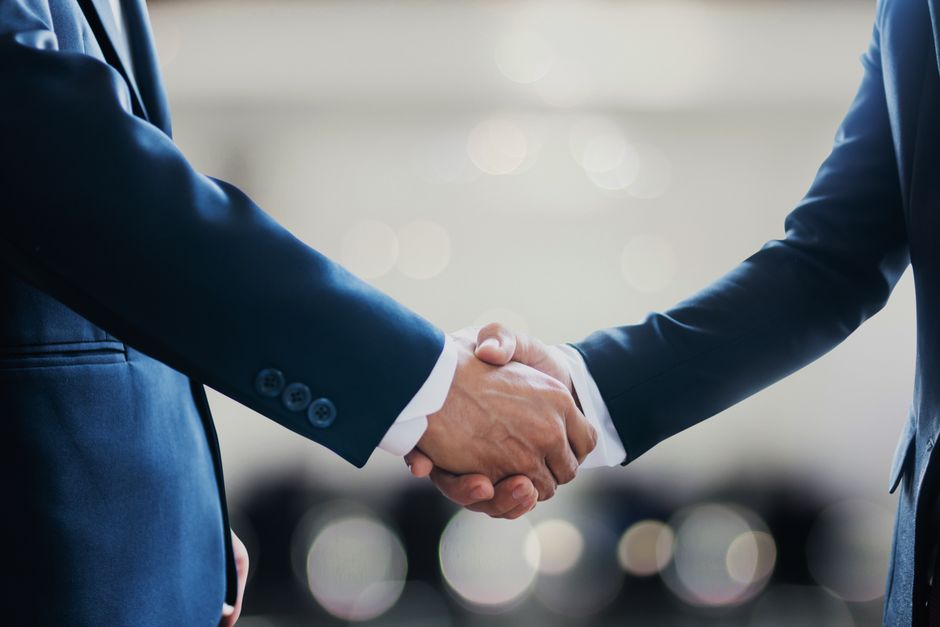 two businessmen shaking hands two businessmen shaking hands