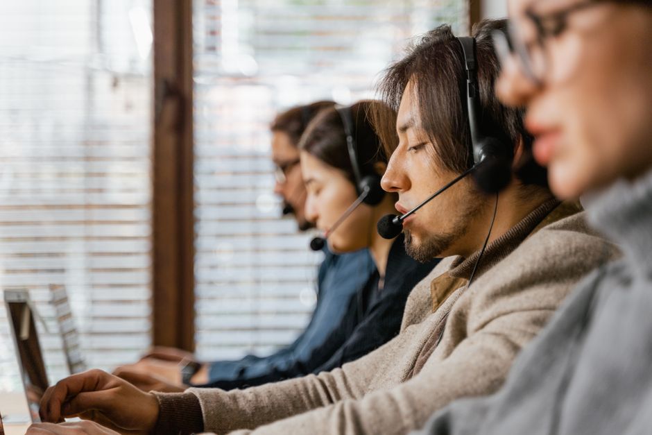 people working at a call center people working at a call center