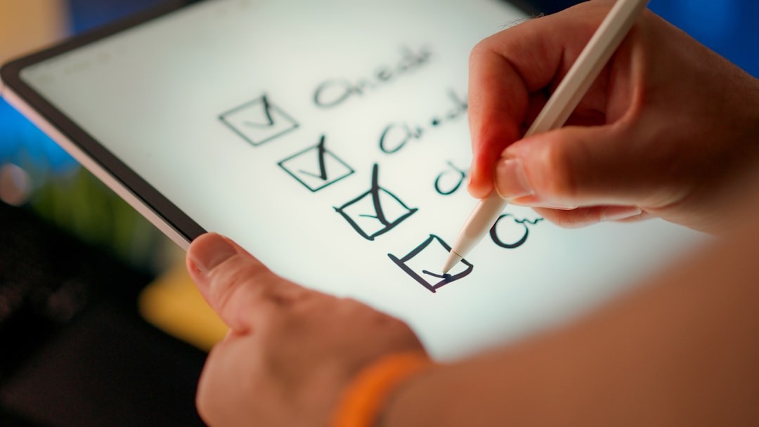 photo-1754548930574-6a995e5eb5a7 working a checklist on a tablet